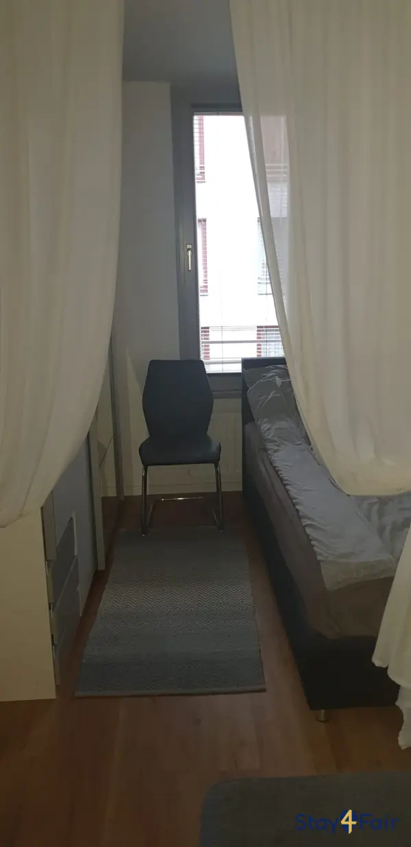 bedroom with semi double bed in apartment near Messe Ost Hannover