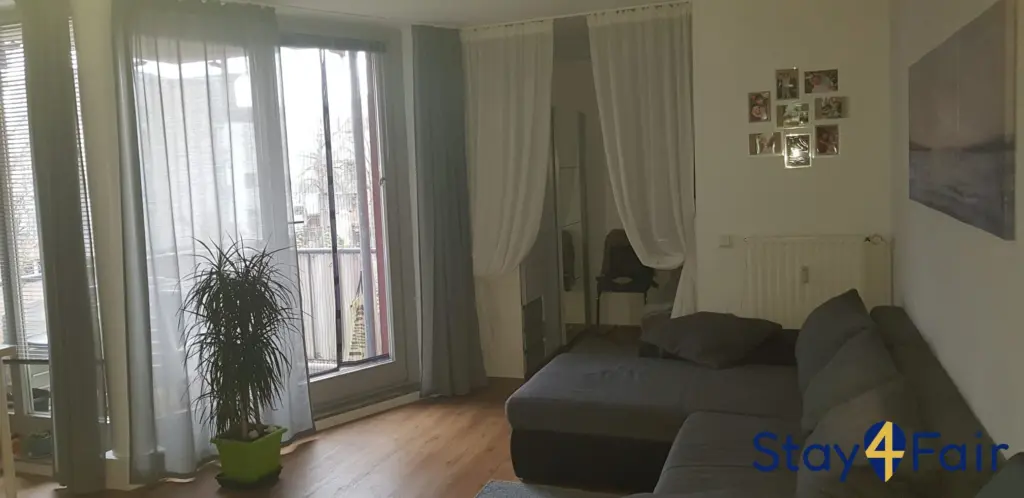 studio living room with sofa bed in 2 room apartment Hannover