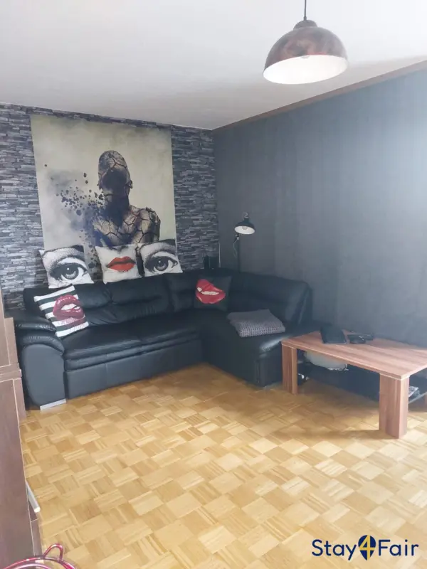 living room with balcony in smoking friendly apartment Hannover