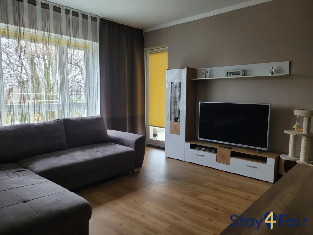 living room with sofa bed in 3 room apartment near Hannover fairground