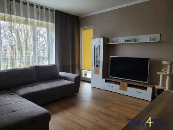living room with sofa bed in 3 room apartment near Hannover fairground