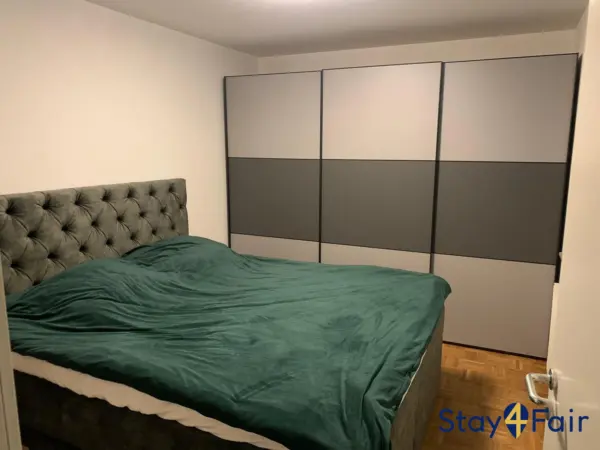 bedroom with double bed in apartment near Hannover exhibition center