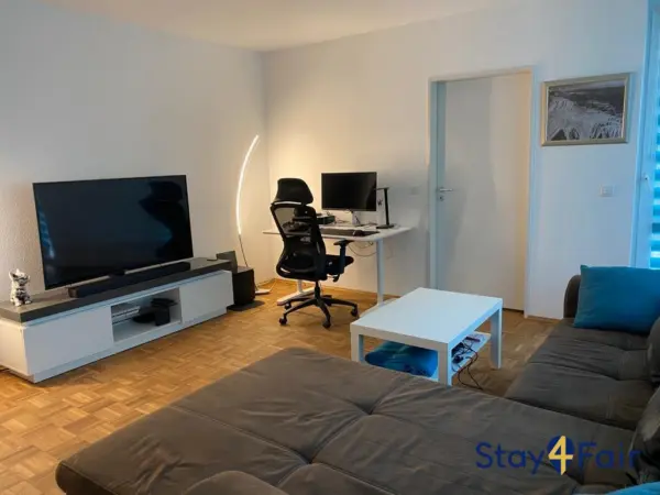 living room with sofa bed in apartment near Hannover Messe Ost
