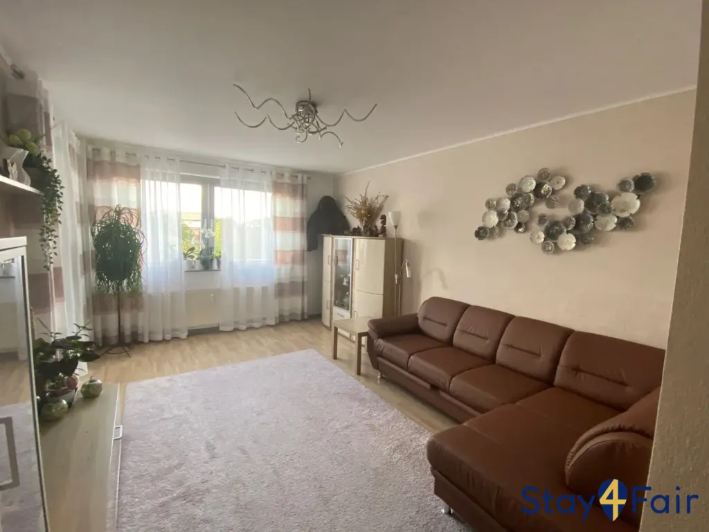 living room with sofa bed in 3 room apartment near Hannover Messe Ost