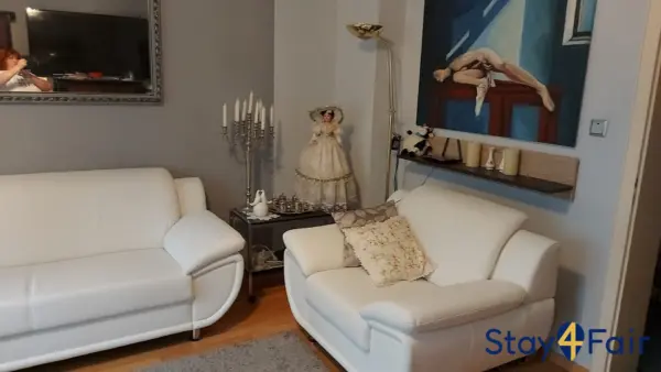 living room with sofa bed in affordable apartment Hannover