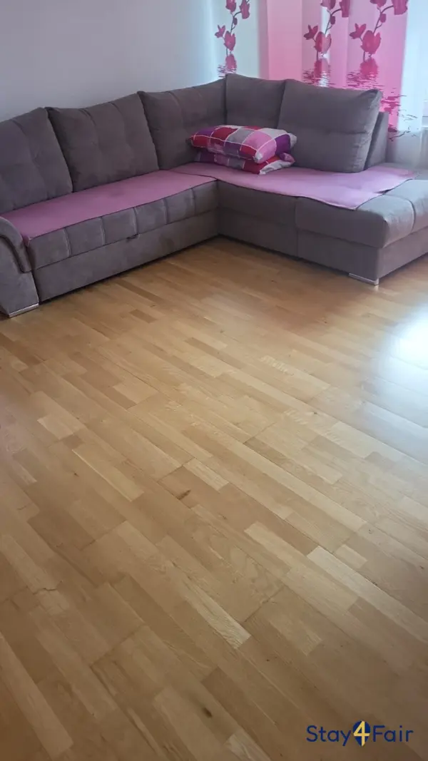 living room with sofa bed in 2 room apartment near Hannover Messe Ost