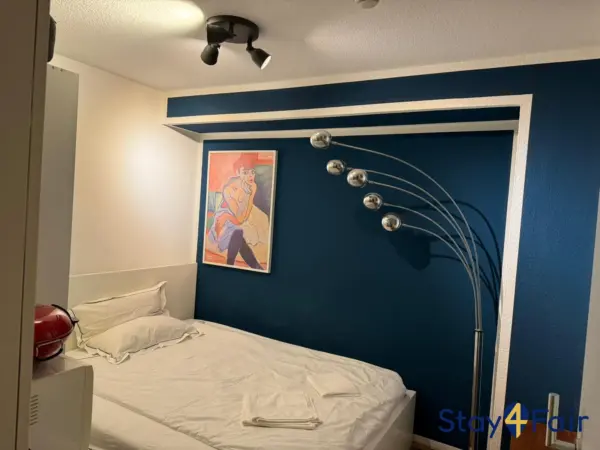 bedroom with semi double bed in apartment near Hannover exhibition center