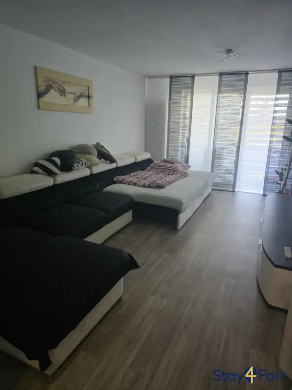 living room with sofa bed in 3 room apartment near Hannover exhibition center