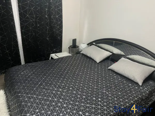 bedroom with double bed in apartment near Hannover exhibition center