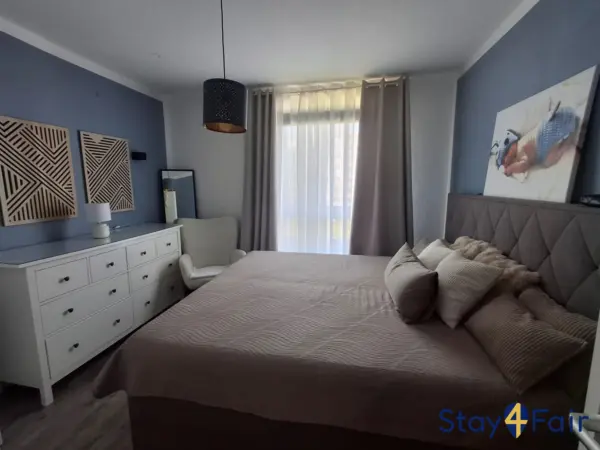 bedroom with large double bed in apartment near Hannover exhibition center